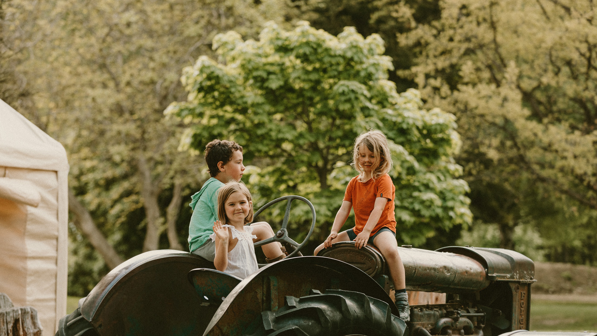 Kids on tractor at The Camp